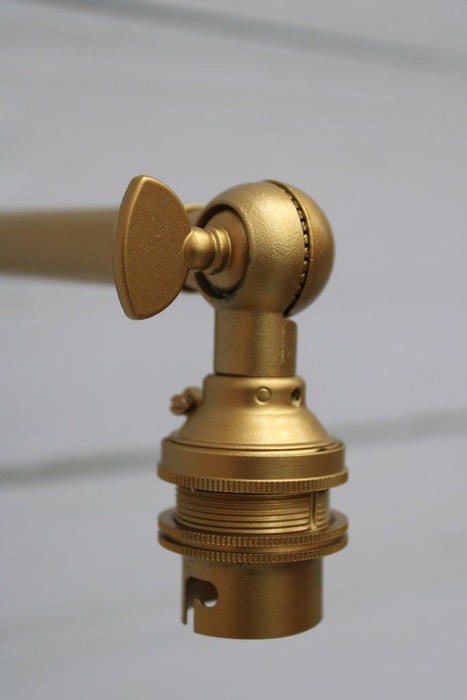Gold/brass adjustable wall sconce knuckle detail